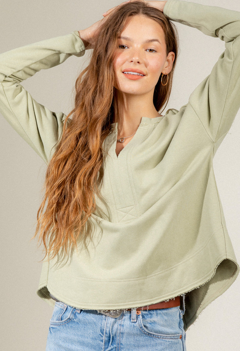 Raw edge solid knit long sleeve top